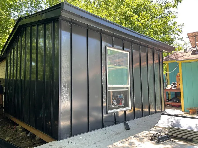 Black standing seam metal wall panels for Roof Inspection in Porter